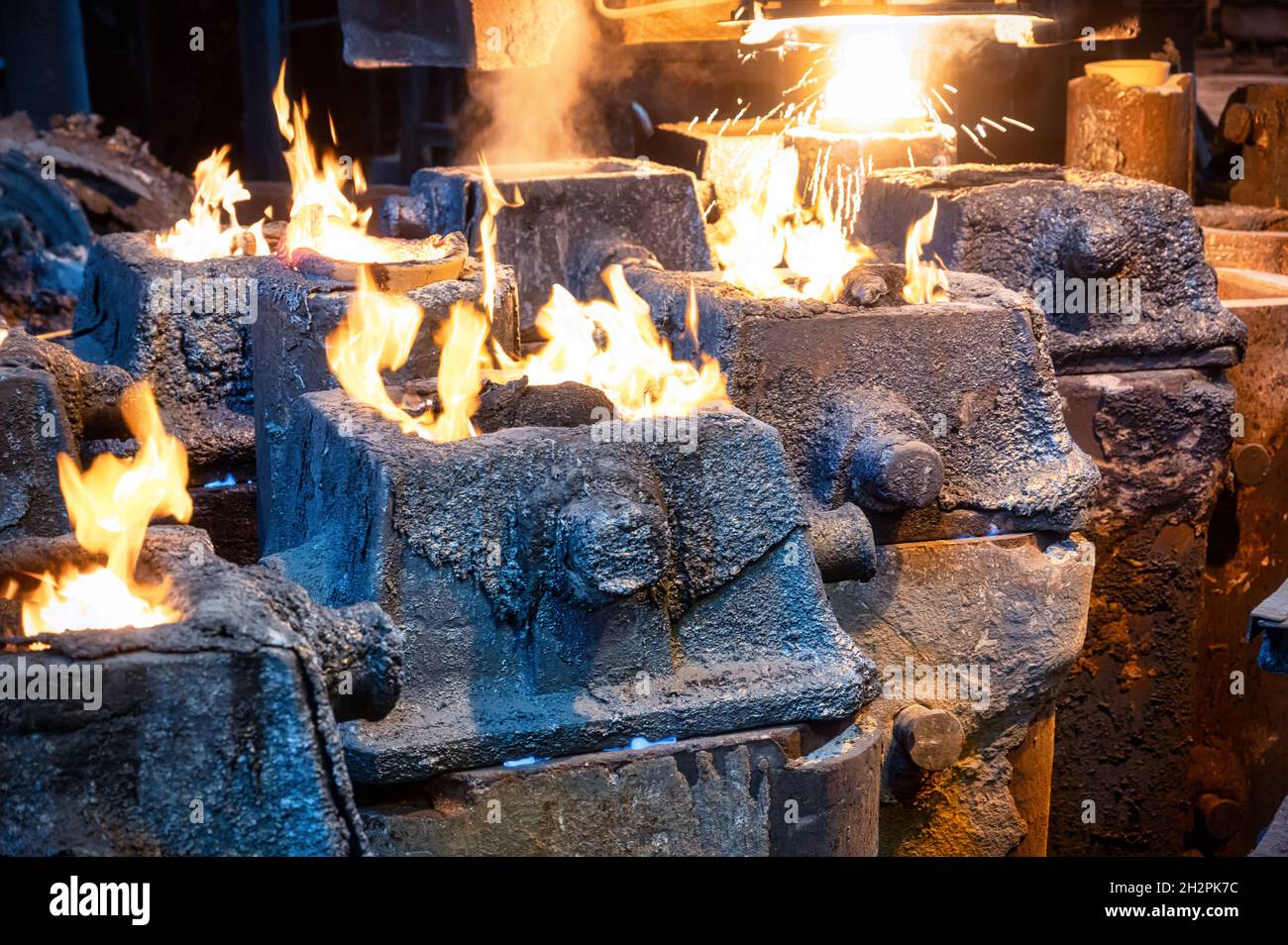 Liquid metal is poured into steel molds from metallurgical ladle Stock ...