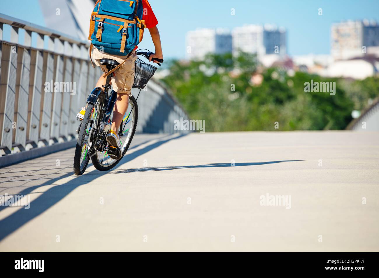 Close up of child bicycle wheels ride on bike lane Stock Photo