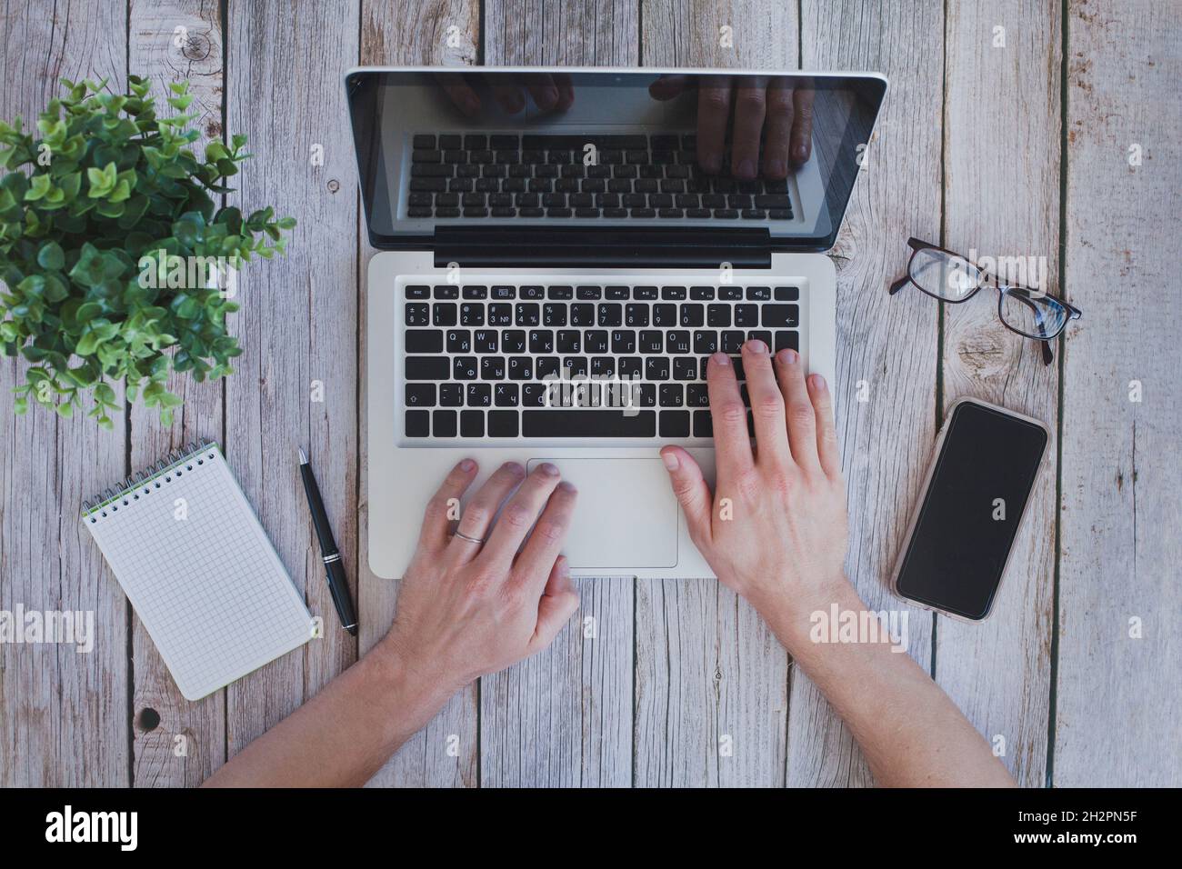 workplace top view, internet search online, using computer, hands typing on laptop from above Stock Photo