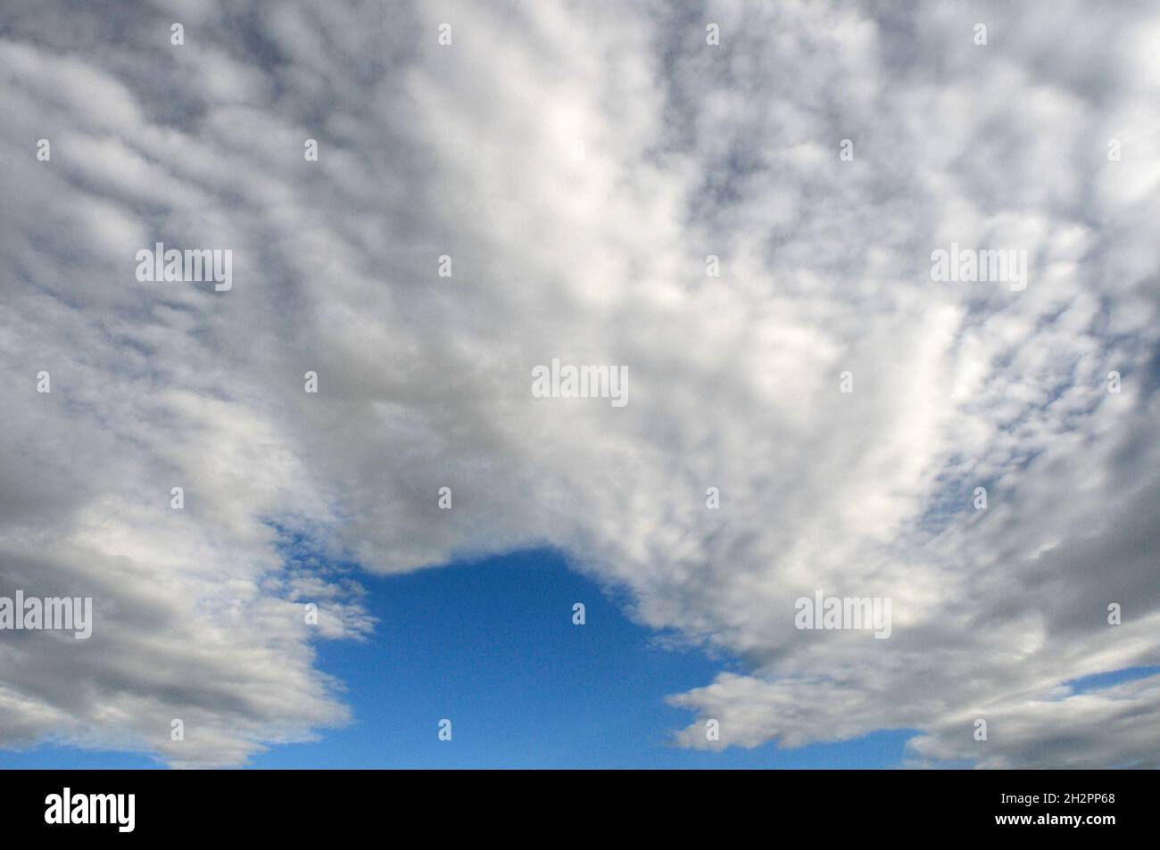 Cirrocumulus and altocumulus clouds Stock Photo