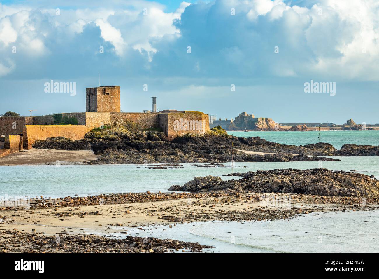 Saint Aubin Fort in a low tide waters with Elizabeth castle in the background, La Manche channel, bailiwick of Jersey, Channel Islands Stock Photo
