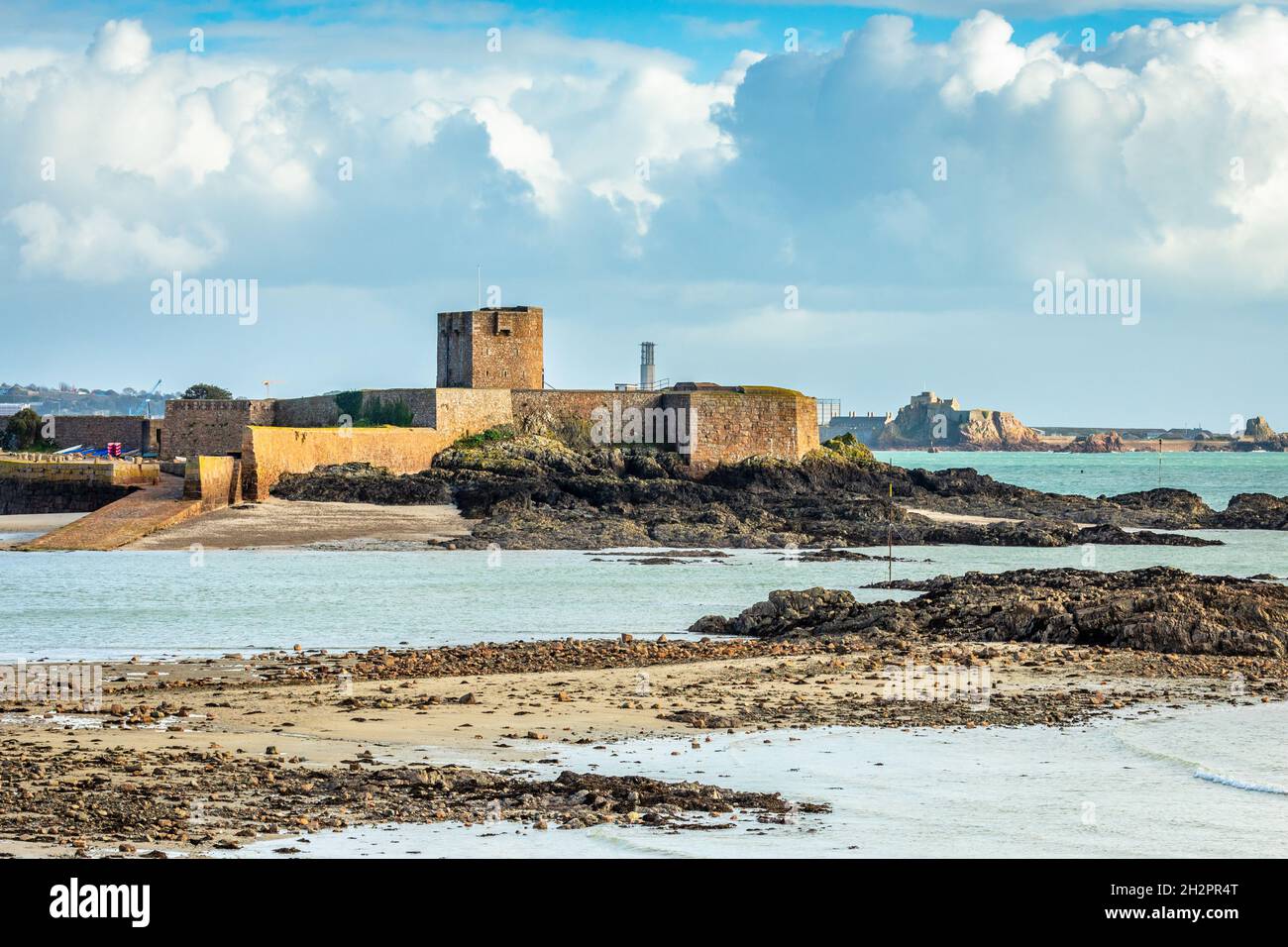 Saint Aubin Fort in a low tide with Elizabeth castle in the background, La Manche channel, bailiwick of Jersey, Channel Islands Stock Photo