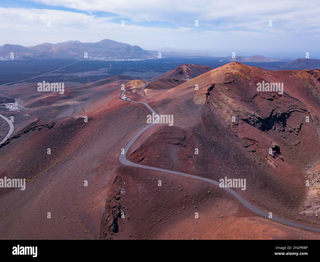 red volcanic mountains with craters  in Timanfaya national park in Lanzarote island, aerial view landscape of Canary islans, nature in Spain Stock Photo