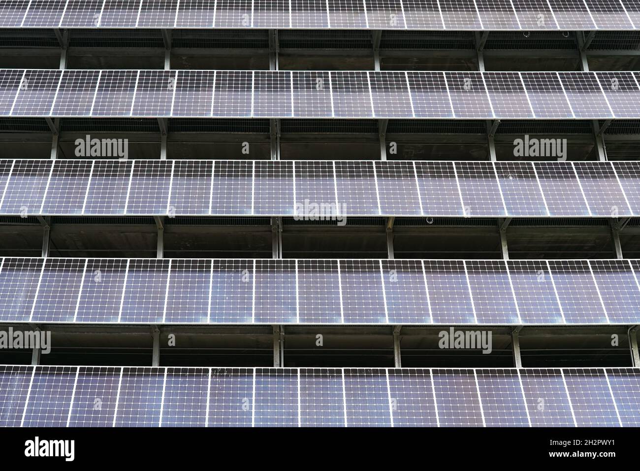 solar panels installed on the side of a building Stock Photo - Alamy