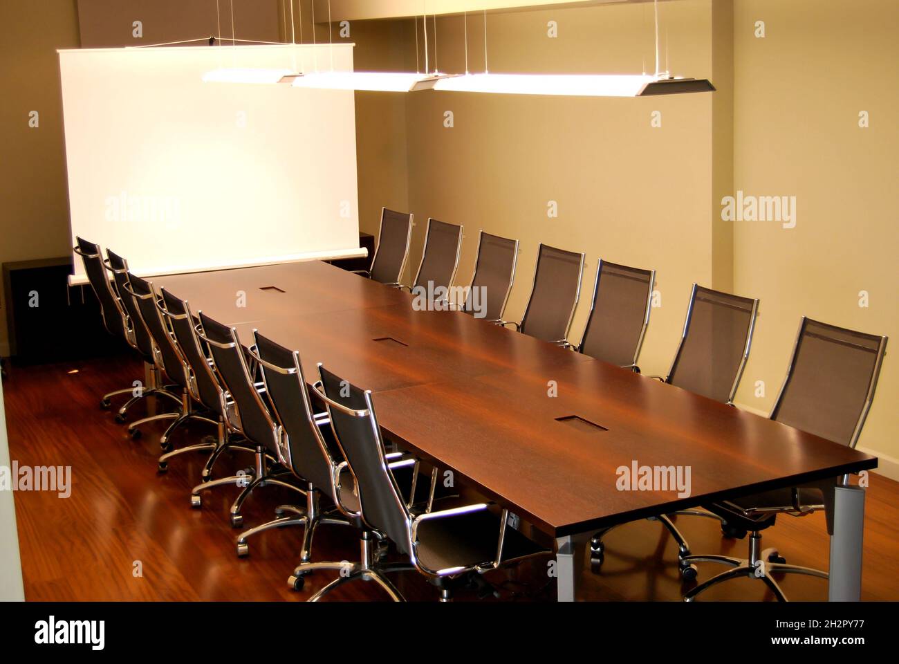 Empty meeting table and chairs in a modern conference room. Business