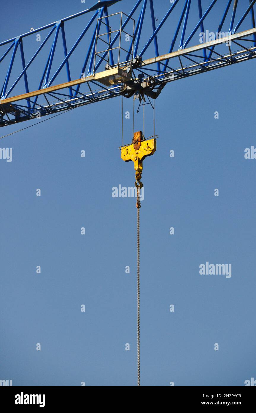 Steel hoisting construction mechanics crane background blue sky Stock