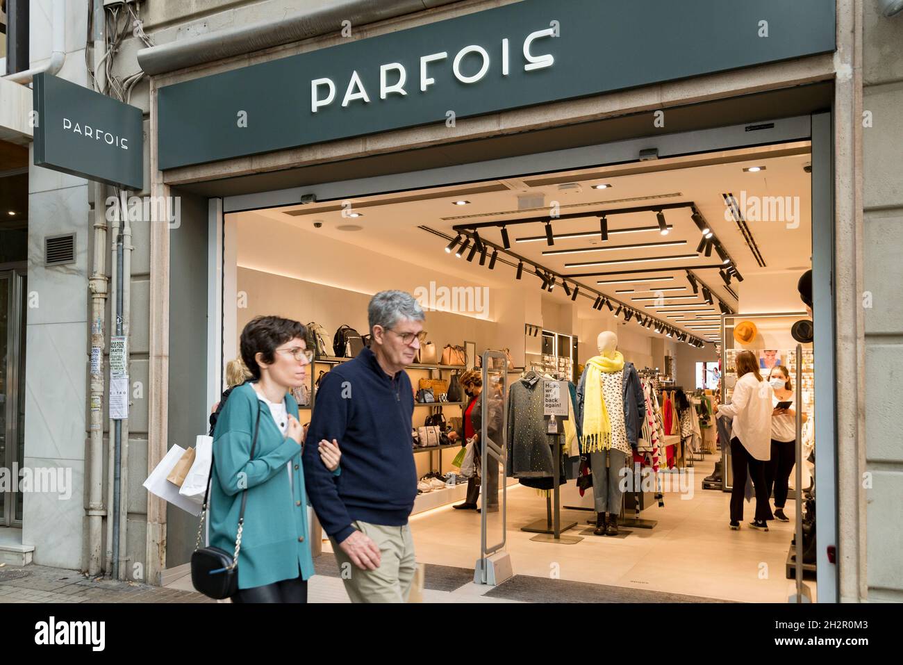 People pass in front of Parfois clothing store in Valencia. (Photo by Xisco  Navarro / SOPA Images/Sipa USA Stock Photo - Alamy