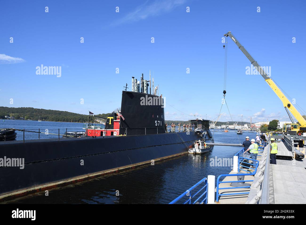 Groton, United States. 15 October, 2021. The U.S. Navy Historic Ship USS Nautilus, is moved from pier side in preparation to be towed up river at Submarine Base New London October 15, 2021 in Groton, Connecticut. Nautilus, was the first nuclear-powered submarine and current Submarine Force Museum centerpiece, and will begin an $36-million dollar preservation project. Credit: CPO Joshua Karsten/U.S. Navy/Alamy Live News Stock Photo
