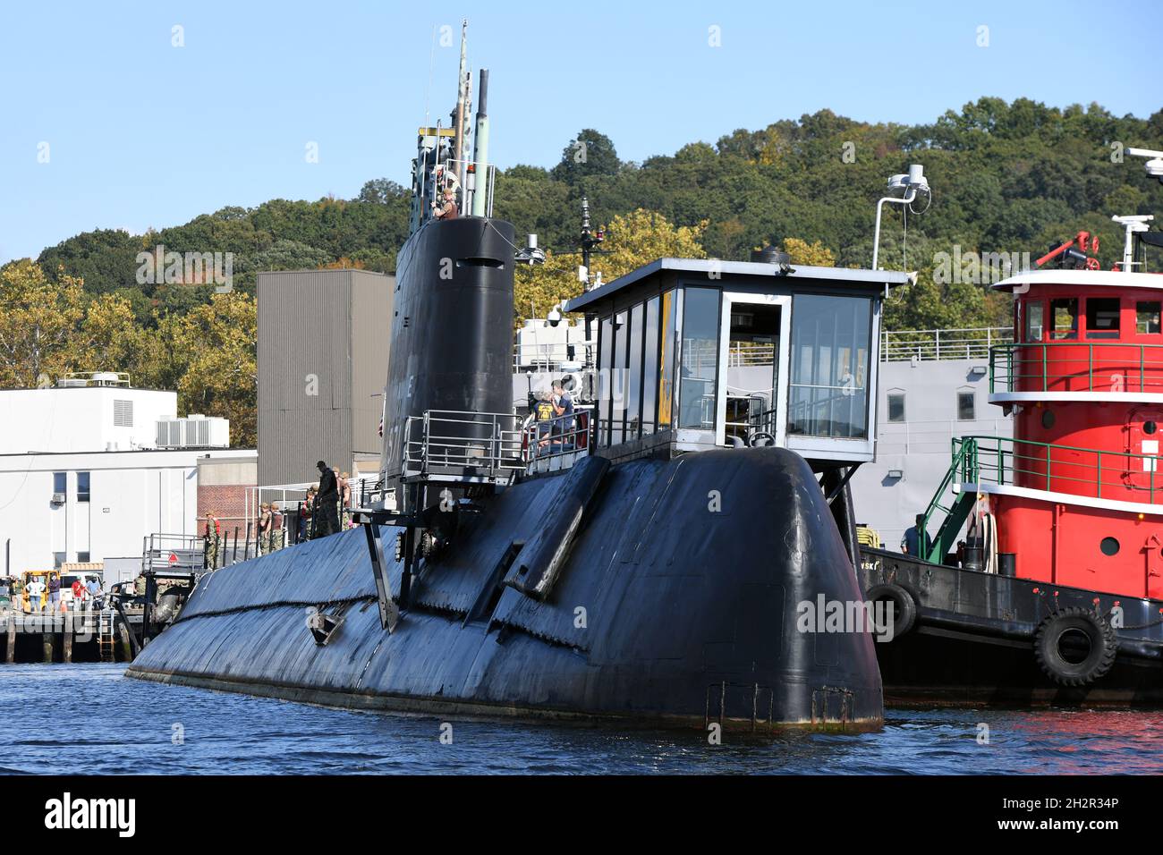 Groton, United States. 15 October, 2021. The U.S. Navy Historic Ship USS Nautilus, is moved from pier side in preparation to be towed up river at Submarine Base New London October 15, 2021 in Groton, Connecticut. Nautilus, was the first nuclear-powered submarine and current Submarine Force Museum centerpiece, and will begin an $36-million dollar preservation project. Credit: CPO Joshua Karsten/U.S. Navy/Alamy Live News Stock Photo