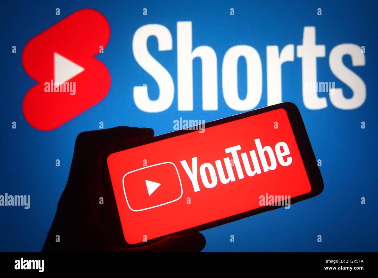 In this photo illustration a YouTube logo of an online video sharing and  social media platform is seen on a smartphone screen with a YouTube Shorts  in the background. (Photo by Pavlo