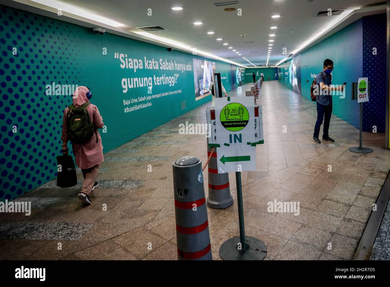 Kuala Lumpur Malaysia 20th Oct 2021 People Wearing Face Masks As A Preventive Measure Against The Spread Of Coronavirus Walk Through An Underground Tunnel That Connects The Light Rail Transit Lrt Station