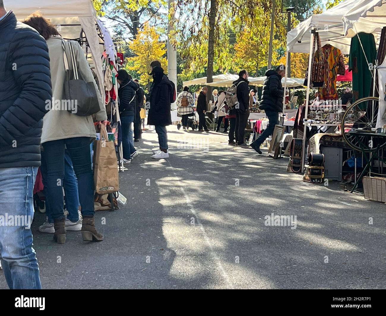 Flea market in Switzerland on a sunny Saturday October afternoon. Buyers  look at merchandise at the stalls. Copy space is on foreground Stock Photo  - Alamy