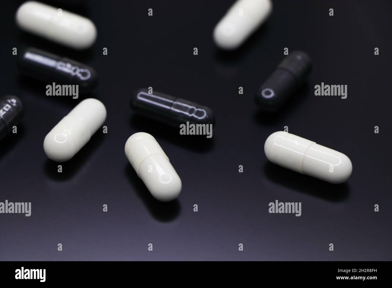 White And Black Drug Gel Capsules Abstract Stock Photo Alamy