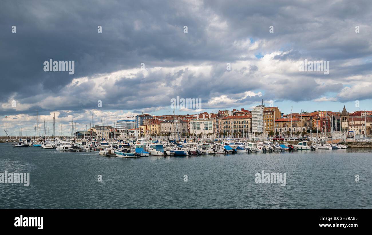 Gijon city marina with dramatic clouds, Asturias Spain. Stock Photo