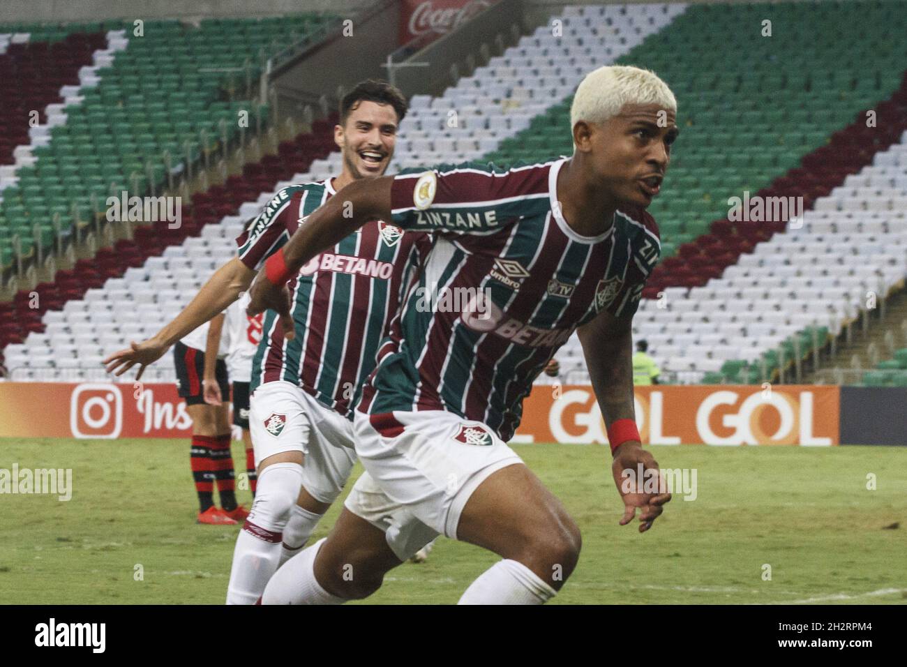 Rio de Janeiro, Rio de Janeiro, Brasil. 23rd Oct, 2021. Brazilian Soccer Championship: Fluminense and Flamengo. October 23, 2021, Rio de Janeiro, Brazil. Celebration of goal scored by John Kennedy, of Fluminense team, during Soccer match between Fluminense and Flamengo, valid for the 28th round of the Brazilian Soccer Championship, held at Maracana stadium, in Rio de Janeiro, on Saturday (23). Fluminense won 3-1, with two goals from John Kenned and one from Abel Hernandez. Credit: Erica Martin/TheNews2 (Credit Image: © Erica Martin/TheNEWS2 via ZUMA Press Wire) Stock Photo