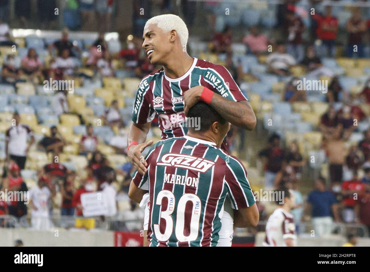 Rio de Janeiro, Rio de Janeiro, Brasil. 23rd Oct, 2021. Brazilian Soccer Championship: Fluminense and Flamengo. October 23, 2021, Rio de Janeiro, Brazil. Celebration of goal scored by John Kennedy, of Fluminense team, during Soccer match between Fluminense and Flamengo, valid for the 28th round of the Brazilian Soccer Championship, held at Maracana stadium, in Rio de Janeiro, on Saturday (23). Fluminense won 3-1, with two goals from John Kenned and one from Abel Hernandez. Credit: Erica Martin/TheNews2 (Credit Image: © Erica Martin/TheNEWS2 via ZUMA Press Wire) Stock Photo