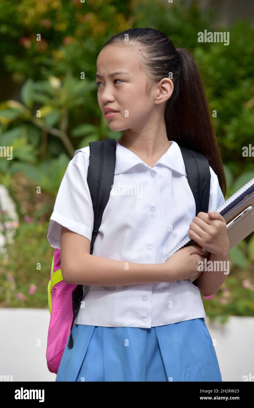 Serious Filipina Female Student With Notebooks Stock Photo - Alamy