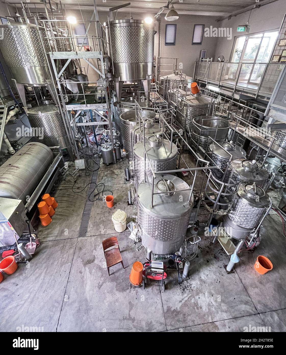 stainless steel fermentation vats and storage tanks in a small botique winery in the Gush Etzion region of the West Bank Stock Photo