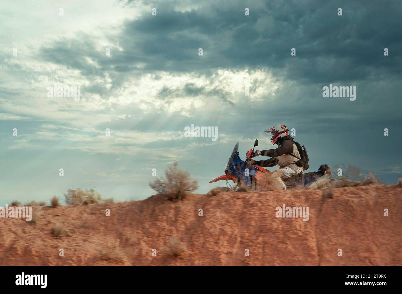 Off-road motorcycle crossing the desert. Stock Photo