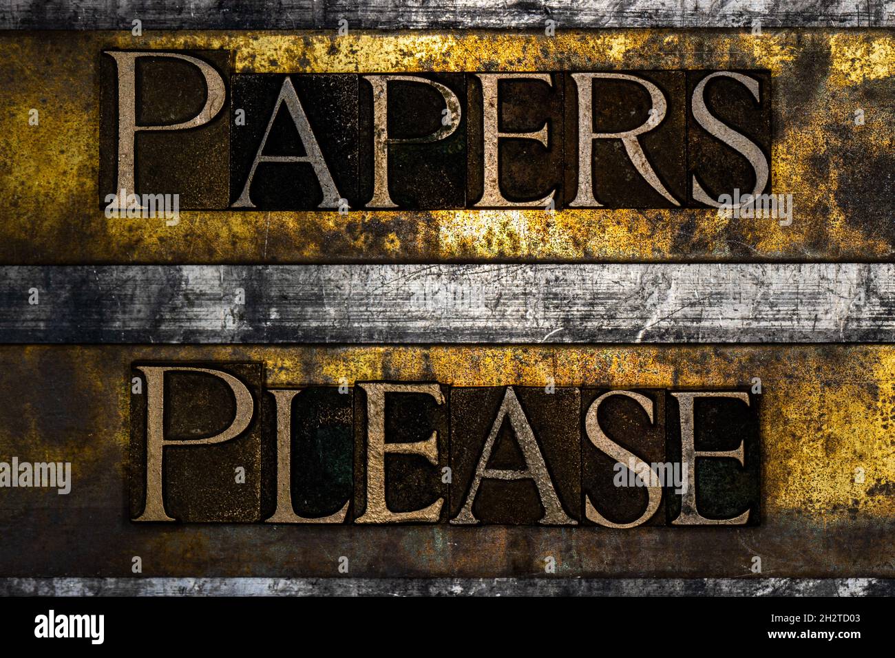 Papers Please text on textured grunge copper and vintage gold background Stock Photo