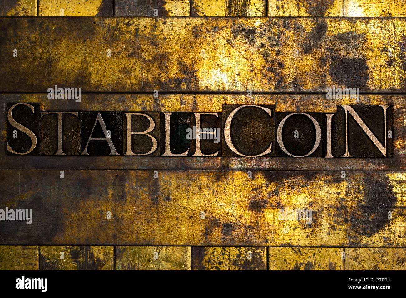 Stablecoin text message on textured grunge copper and vintage gold background Stock Photo