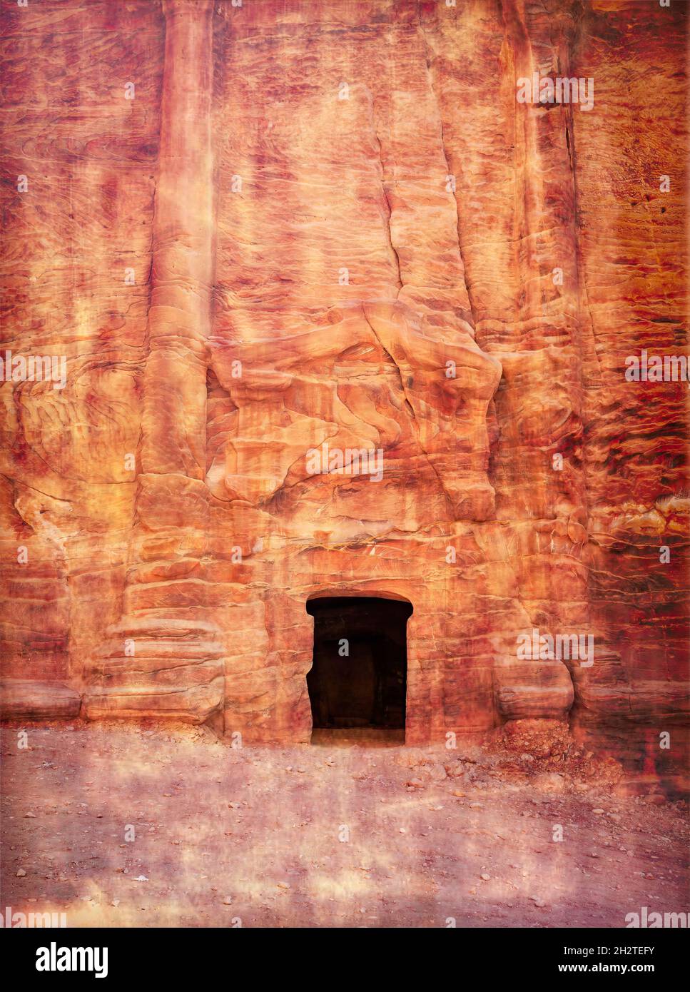 Entrance in a tomb carved in red sand stone located in the ancient city ...