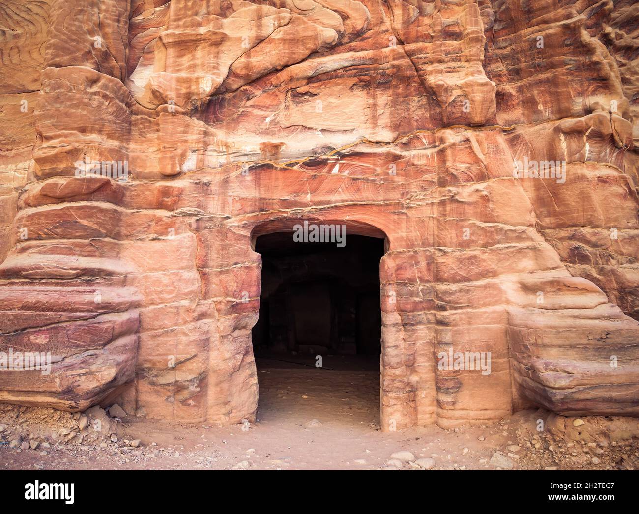 Entrance in a tomb carved in red sand stone located in the ancient city ...