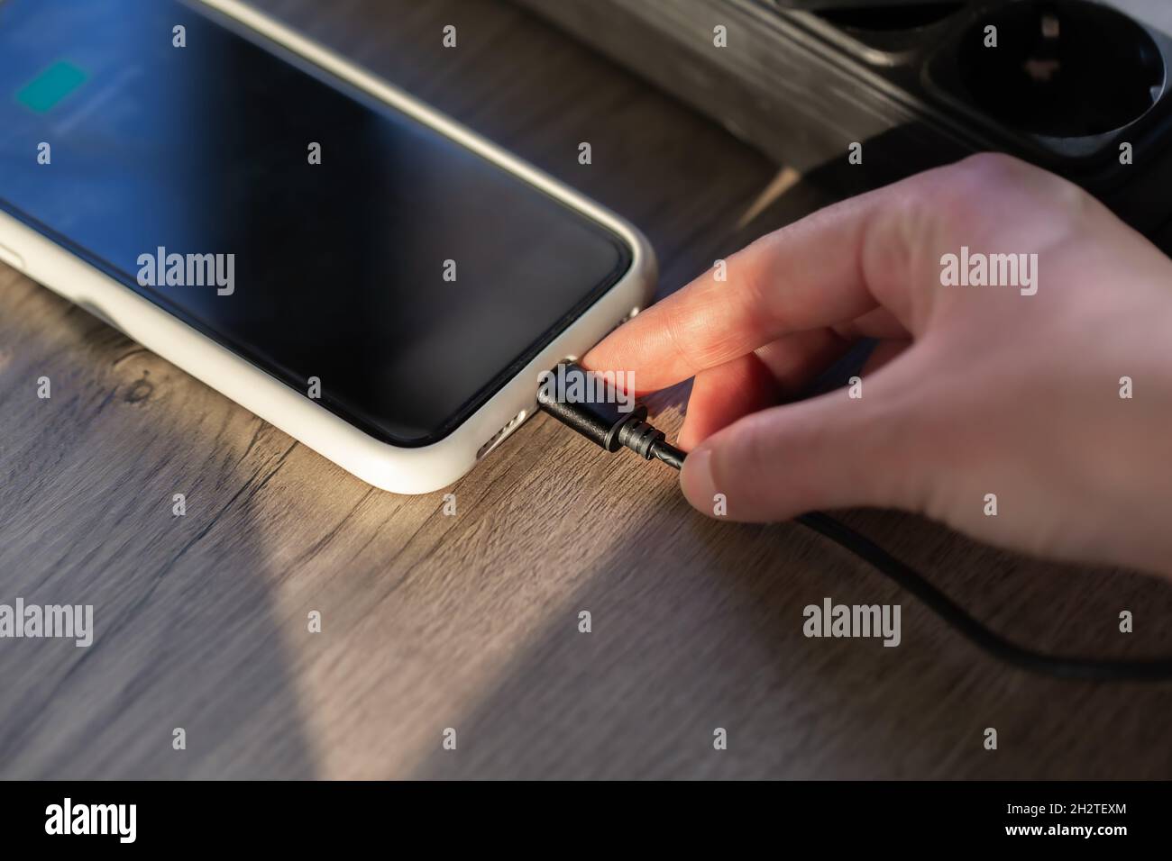 Magnetic cable for charging smartphone, close up. Stock Photo