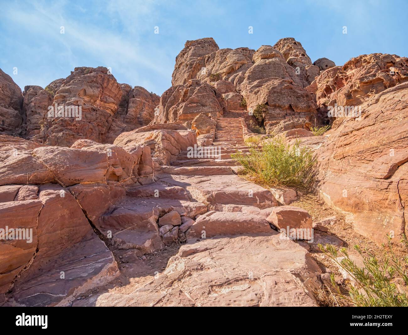 View with the Al-Khubtha Trail stone stairs that leads to the Treasury Viewpoint in the ancient city of Petra, Jordan Stock Photo