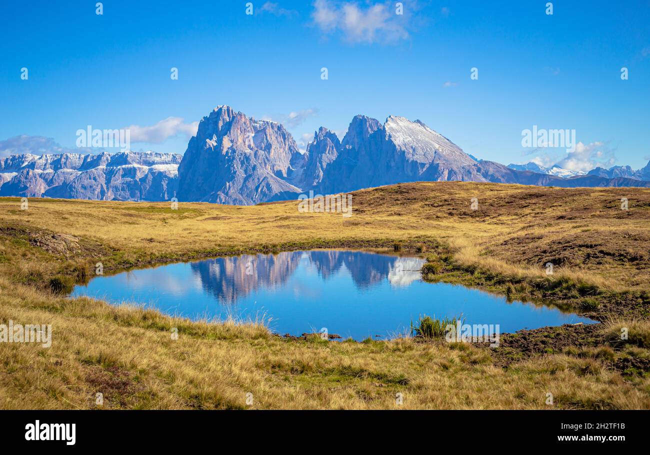 Dolomites reflection, view from Seiser Alm to Sella moutain range with Plattkofel and Langkofel Stock Photo