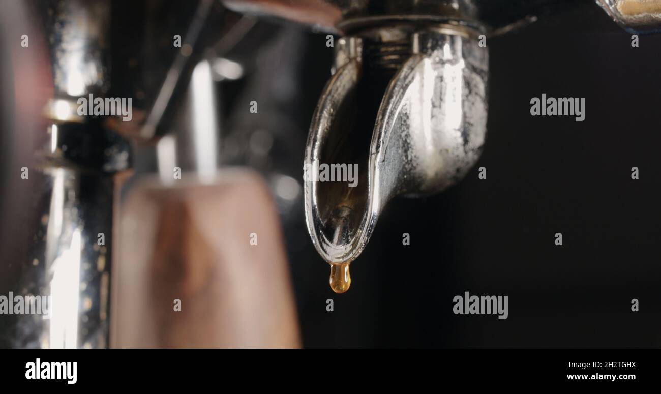 pour espresso from single spout portafilter, wide photo Stock Photo