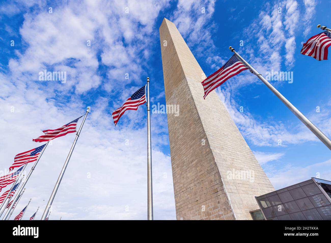 The giant Washington Monument with flags Stock Photo Alamy
