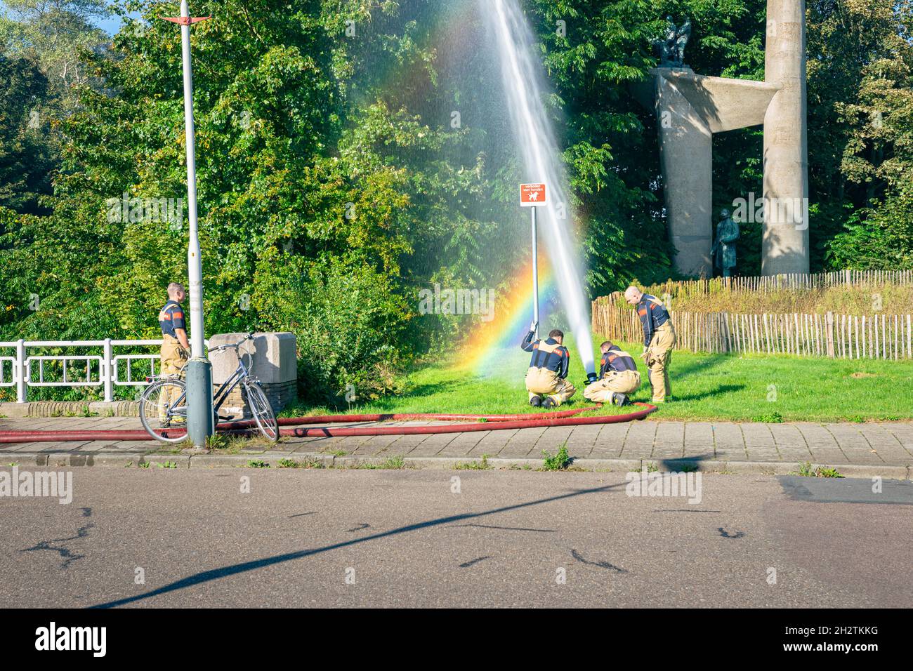 The Hague, Netherlands - October 8, 2021: Firefighters do an exercise near Troelstra Monument in the city of The Hague, The Netherlands. Stock Photo