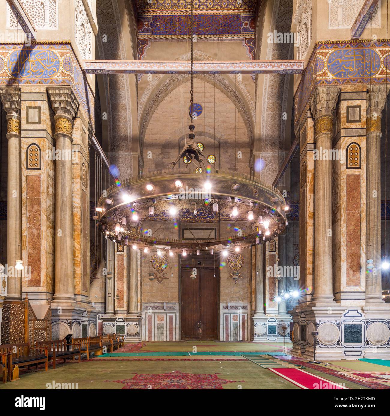 Interior of public historical Al Rifaii Mosque, aka Royal Mosque, suited in Old Cairo, Egypt, with huge marble columns and walls decorated with Arabic calligraphy Stock Photo