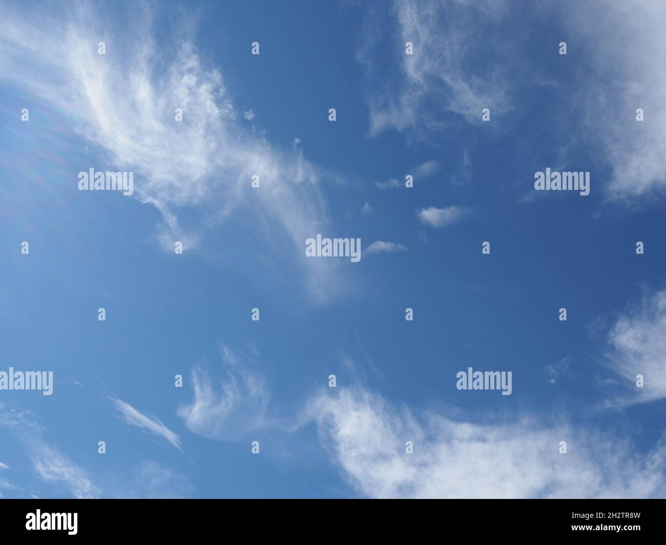blue sky with clouds useful as a background Stock Photo - Alamy