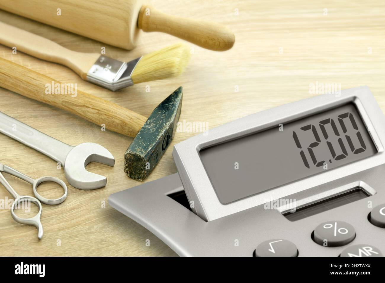 Minimum Wage 12,00 Euro and calculator with tools Stock Photo