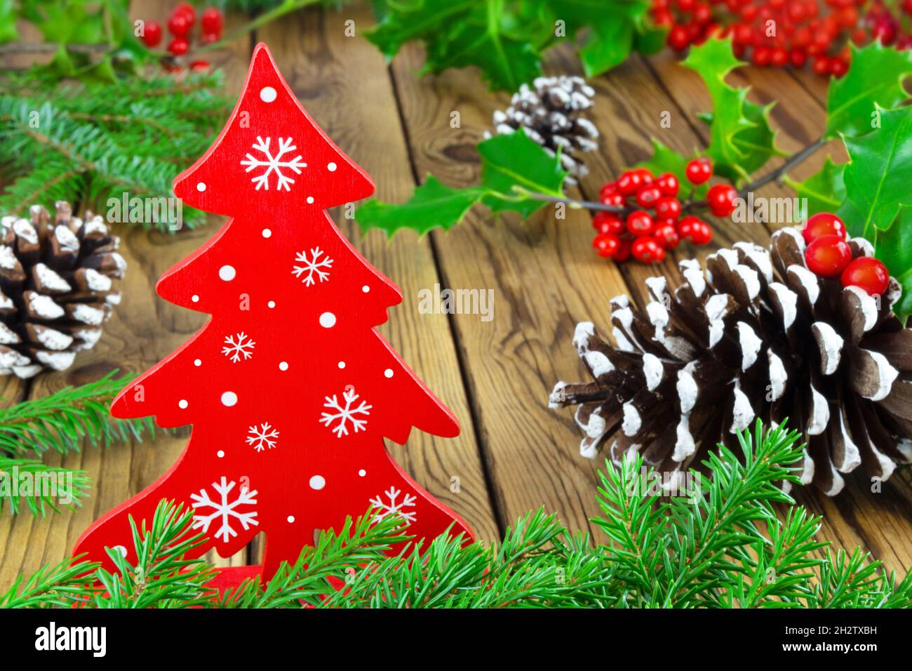 Natural wooden Christmas decoration with fir tree and fir cones Stock Photo