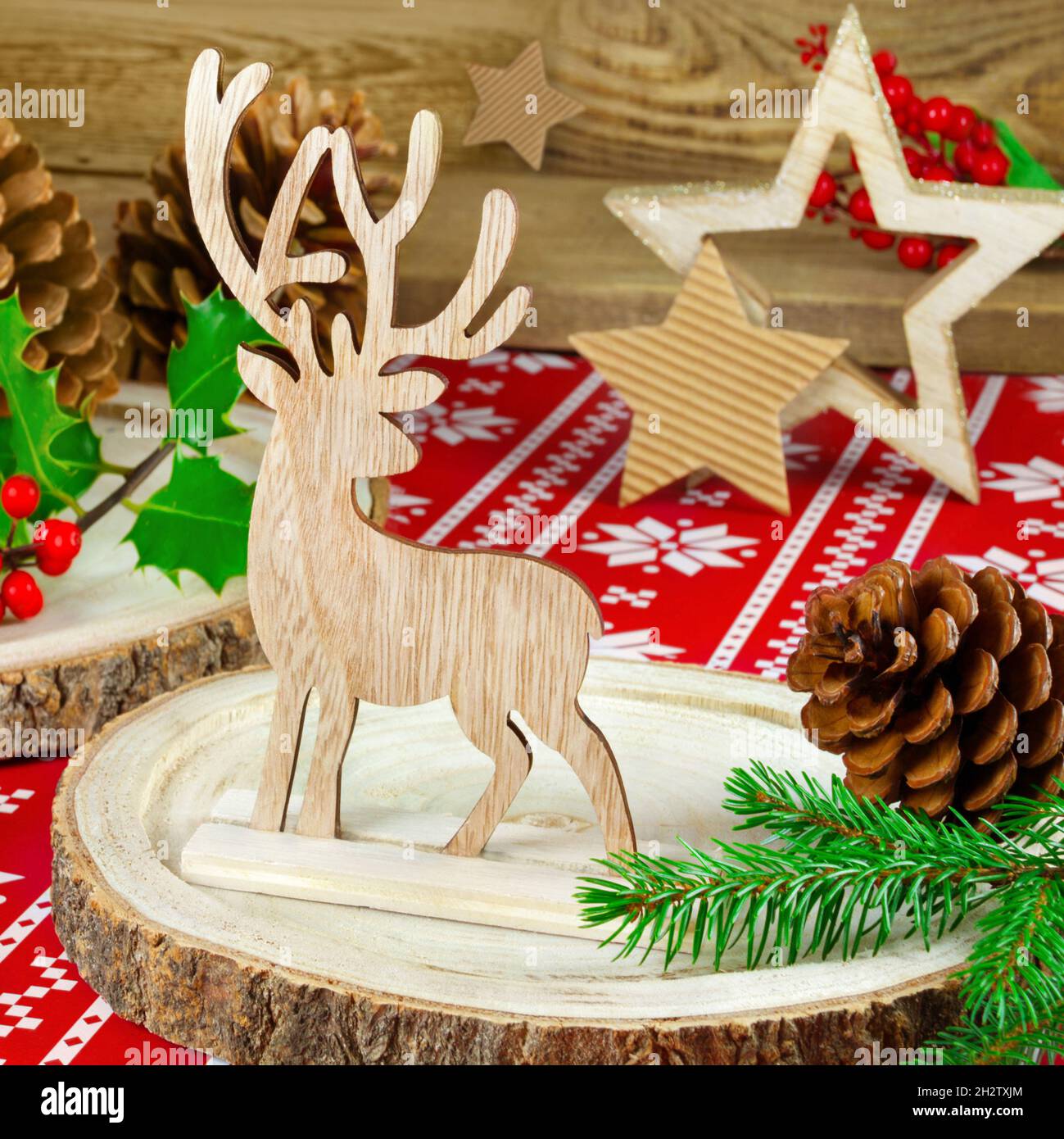 Natural wooden Christmas decoration with reindeer and fir branches ...