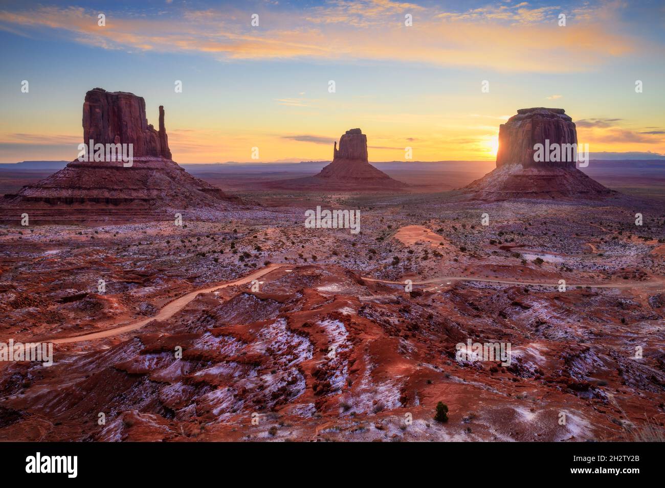 Sun rise behind butte at Monument Valley scenic viewpoint, Arizona Stock Photo