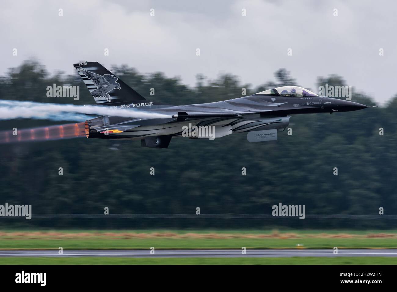 Radom, Poland - August 25, 2018: Radom Air Show - Belgian Air Force F-16 (FA-101) high-speed lowpass with smoke on and afterburner Stock Photo