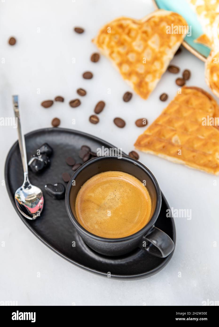 Fresh espresso coffee with coffee beans on white marble background Stock Photo