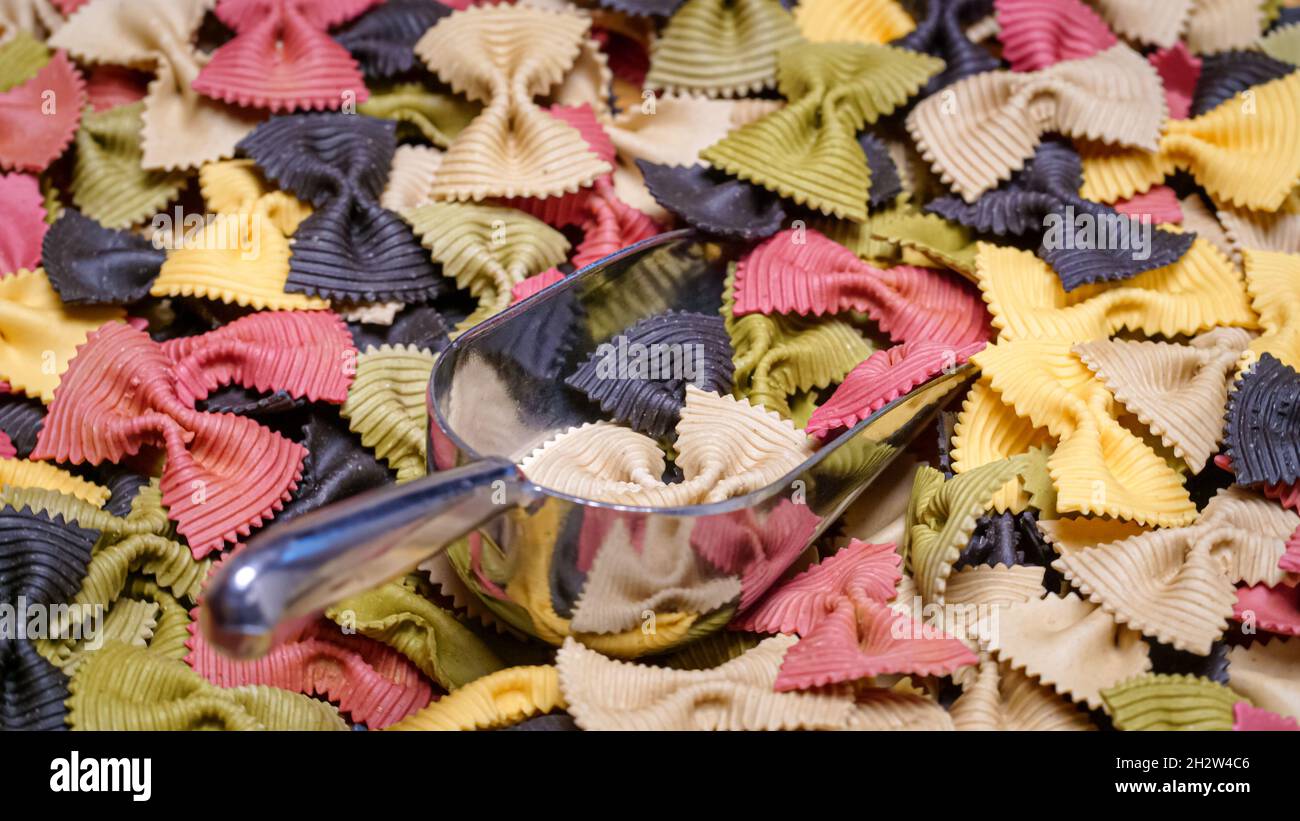 Colored Farfalle Pasta bow tie pasta background Stock Photo - Alamy