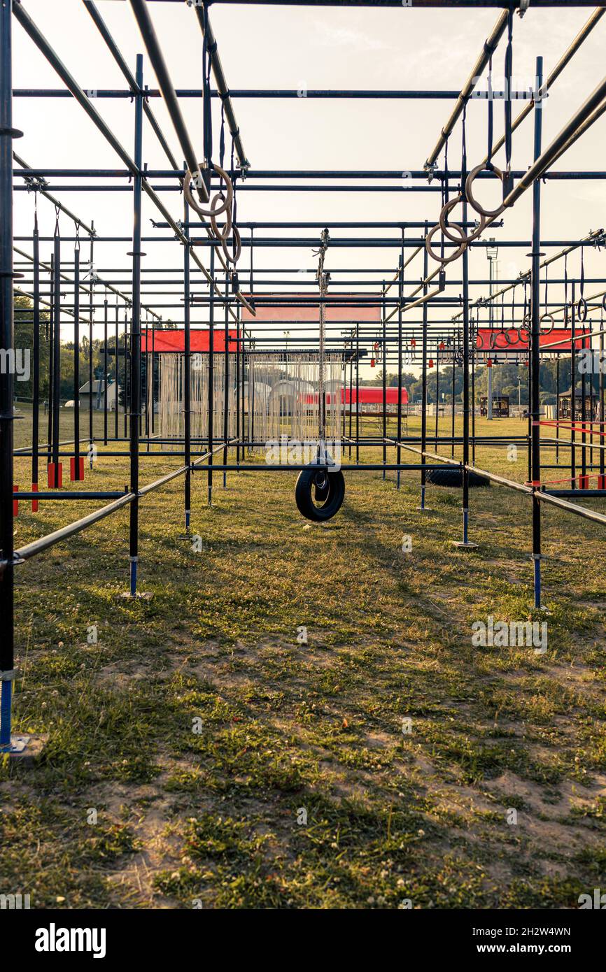 Obstacle course race ocr, hanging pendulum perspective, sunset Stock Photo