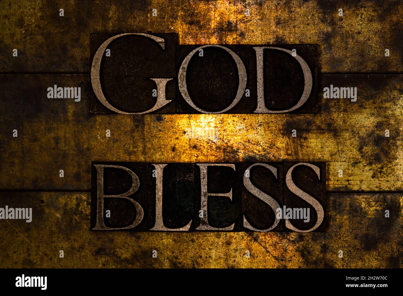 God Bless text on textured grunge copper and vintage gold background Stock Photo