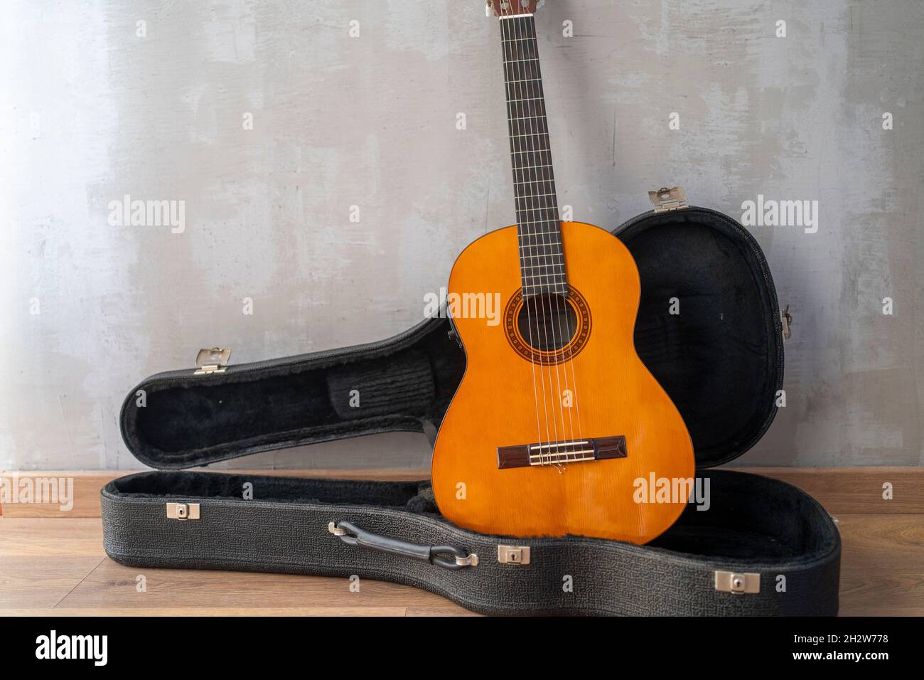Classic acoustic guitar on hard case Stock Photo