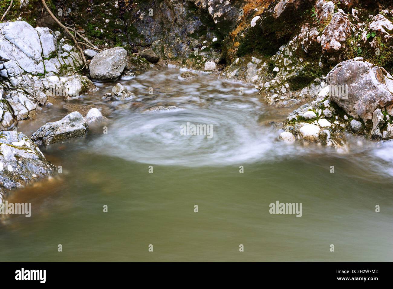 vortex forming on a mountain stream, image taken in Apuseni mountains, Transilvania Stock Photo