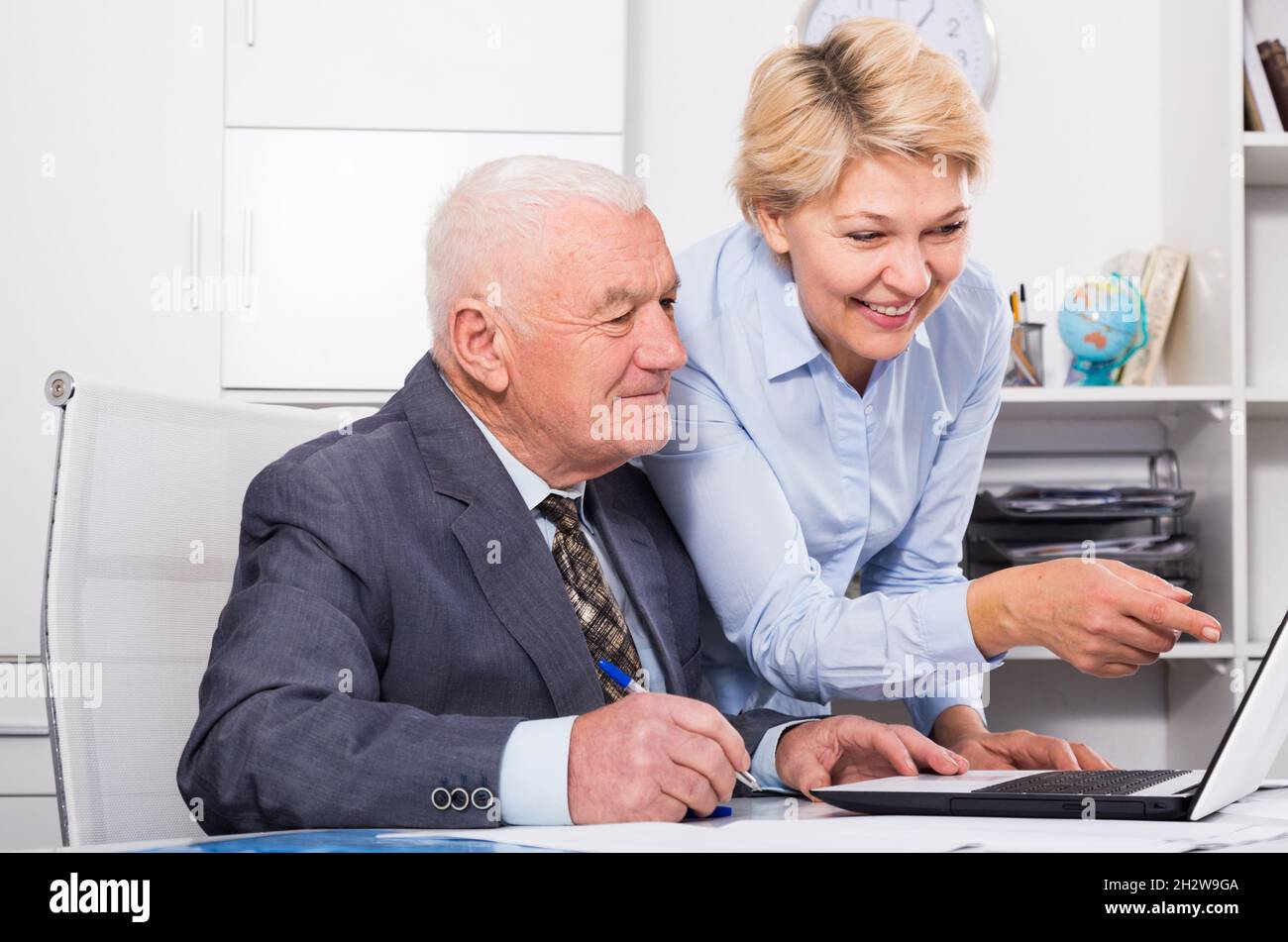 Manager and secretary working Stock Photo - Alamy