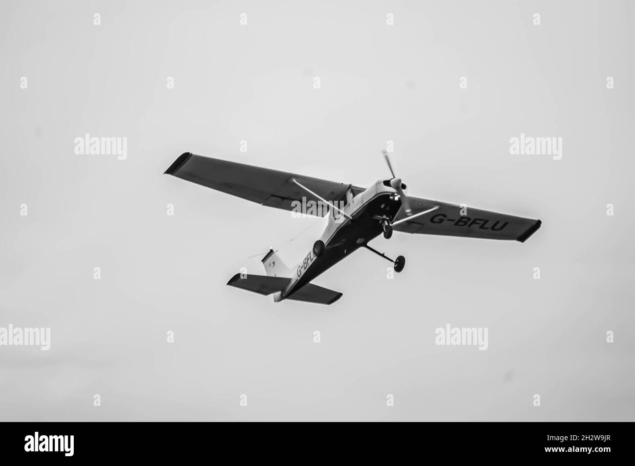 ELSTREE, LONDON, ENGLAND- 17 October 2021: Cessna F152 small plane in the sky after taking off from London Elstree Aerodrome Stock Photo