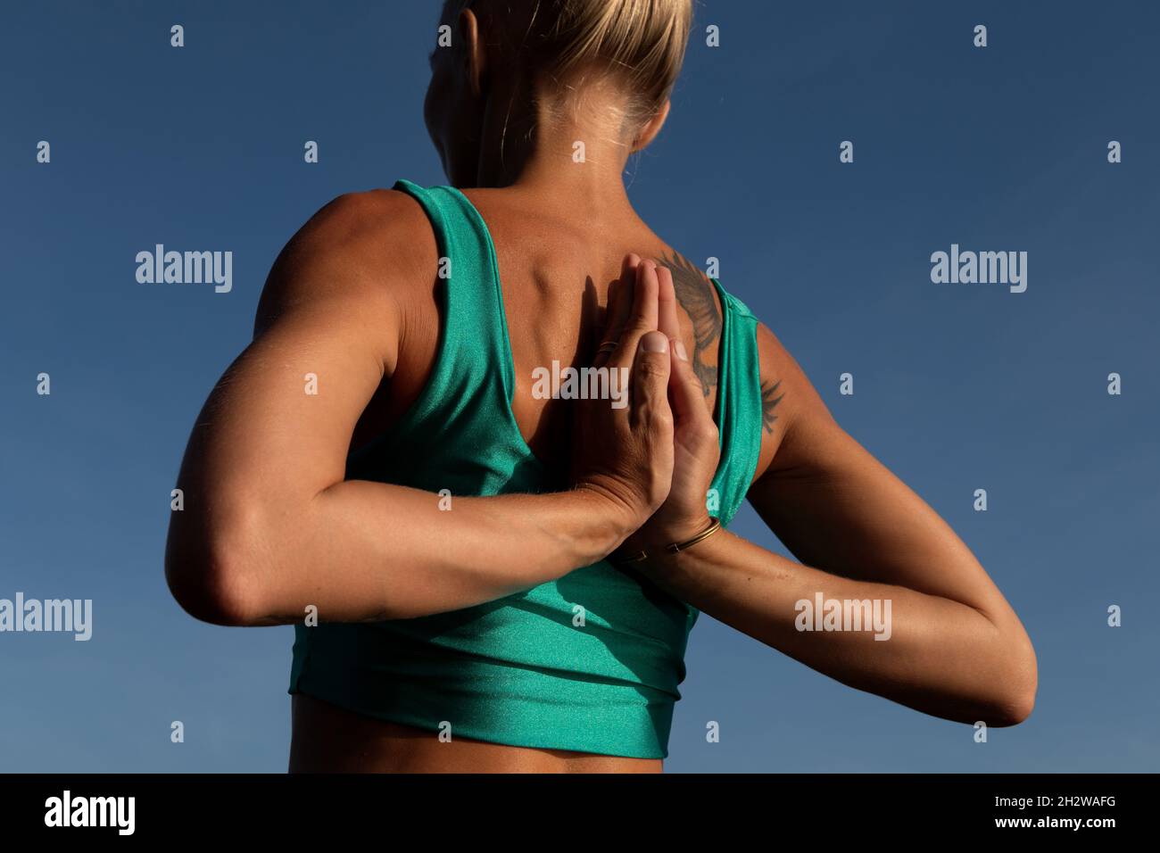 beautiful woman doing yoga. middle plan. bali Stock Photo