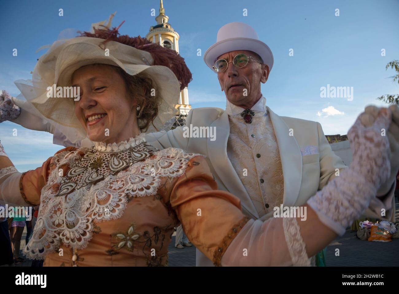 Suzdal, Russia. 8th of August, 2015. People in 19th century clothes dancing at the main street of Suzdal medieval town during the celebration of the City Day, Vladimir oblast, Russia Stock Photo